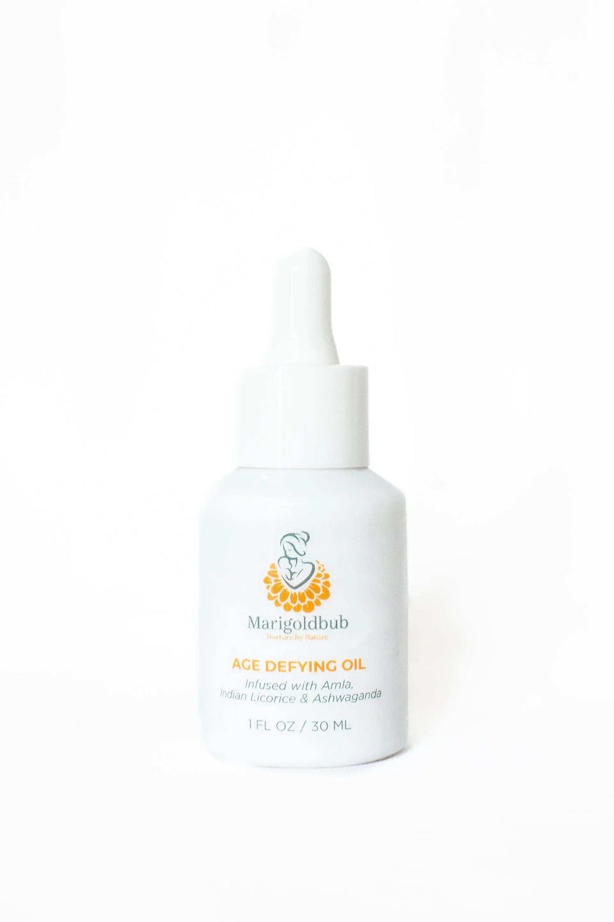 Age Defying Face Oil in a white glass dropper bottle with a white pipette and colorful botanical logo