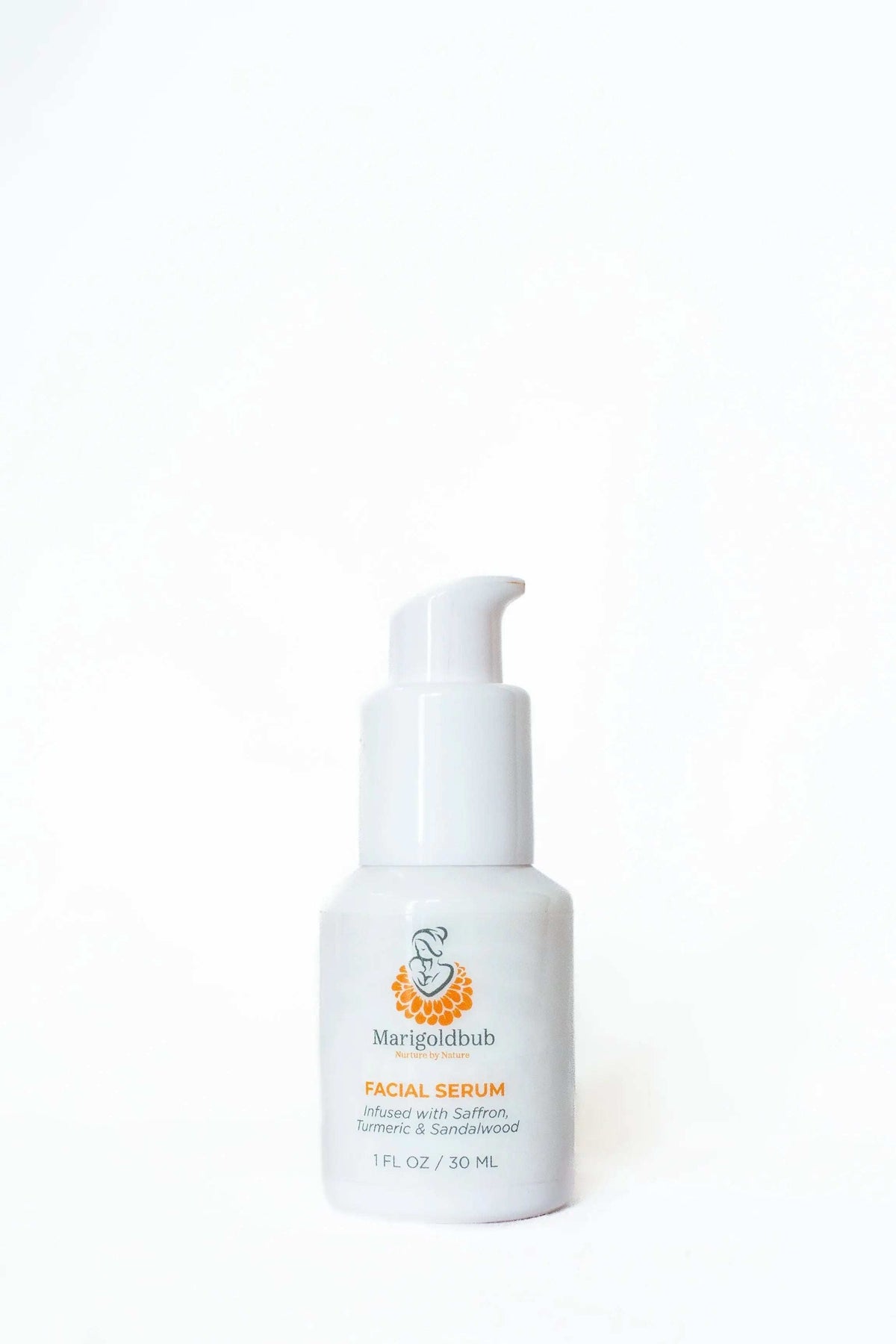 Illuminating Face Serum in a white pump bottle with a minimalist label and orange marigold illustration